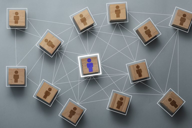 Wooden cube block print screen person icon which link connection network for organisation structure social network and teamwork concept